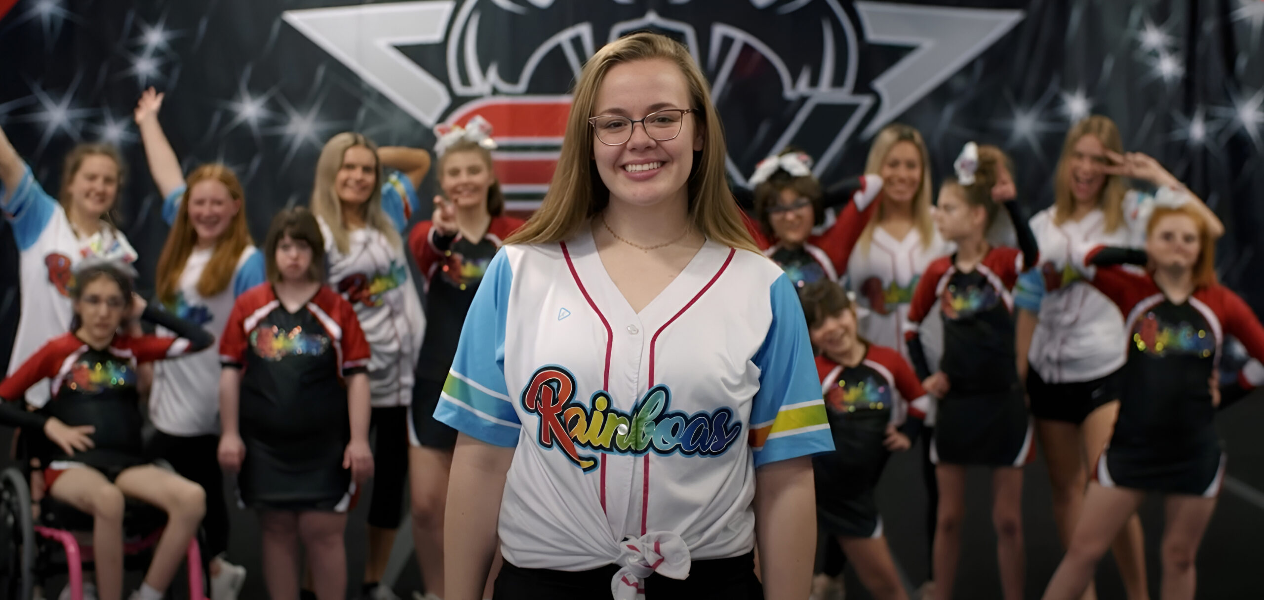 Female youth cheerleading squad hero