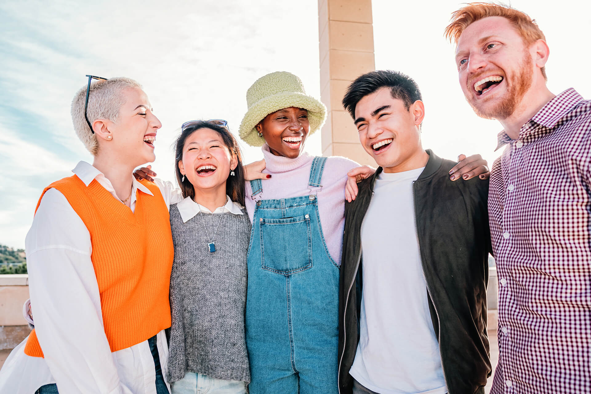 Group of multiracial friends meeting smiling and enjoying in a sunny day. high quality photo
